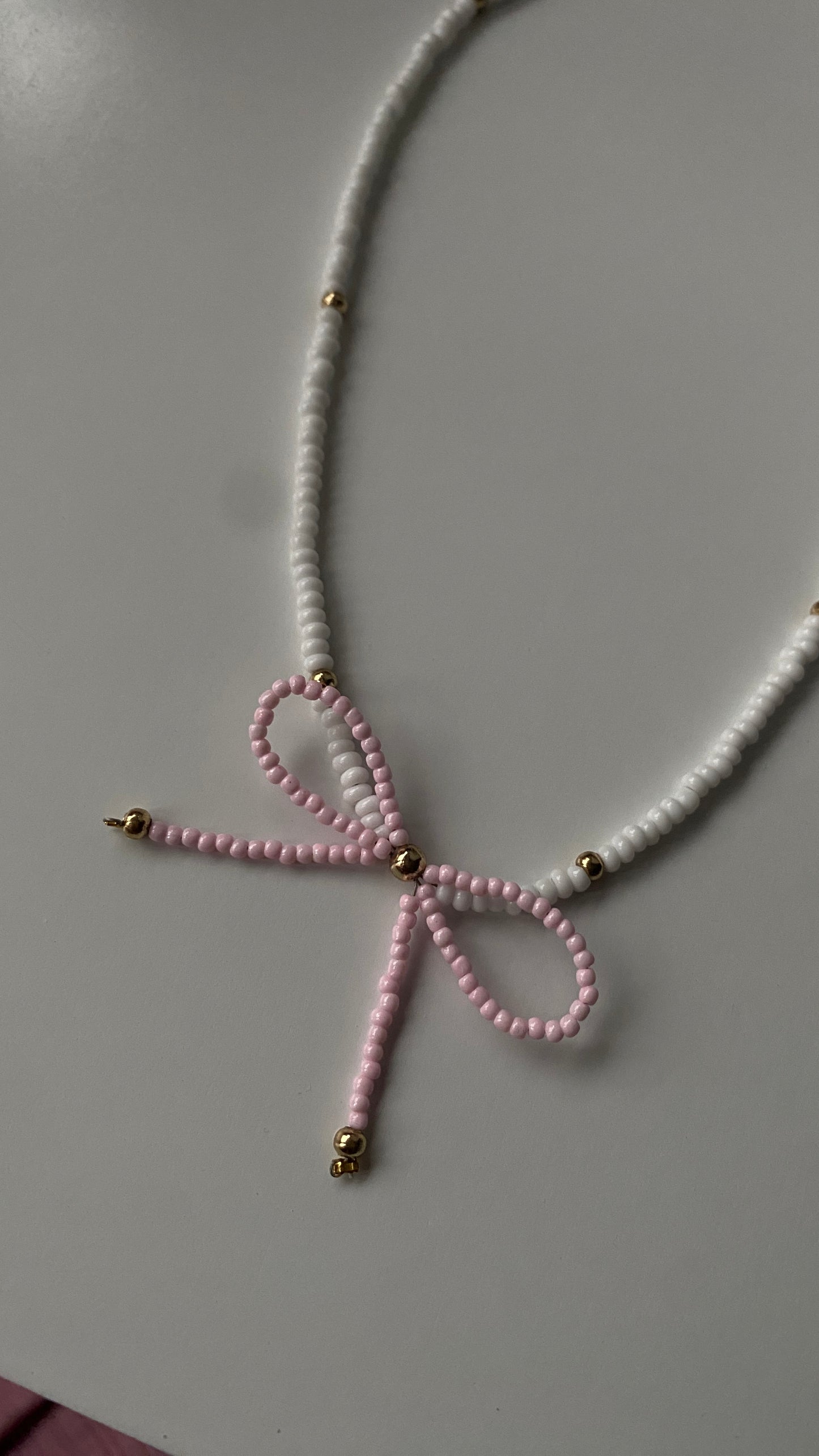 Beaded bow white & pink necklace ๐